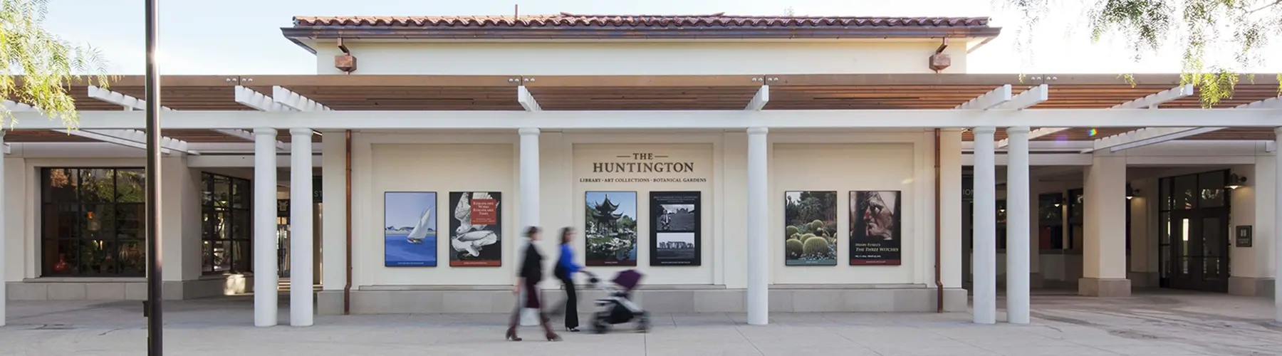 people walking in front of Huntington entrance