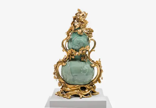 Stoneware with slip-trailed, molded and applied decoration, celadon glaze, gilt-bronze
