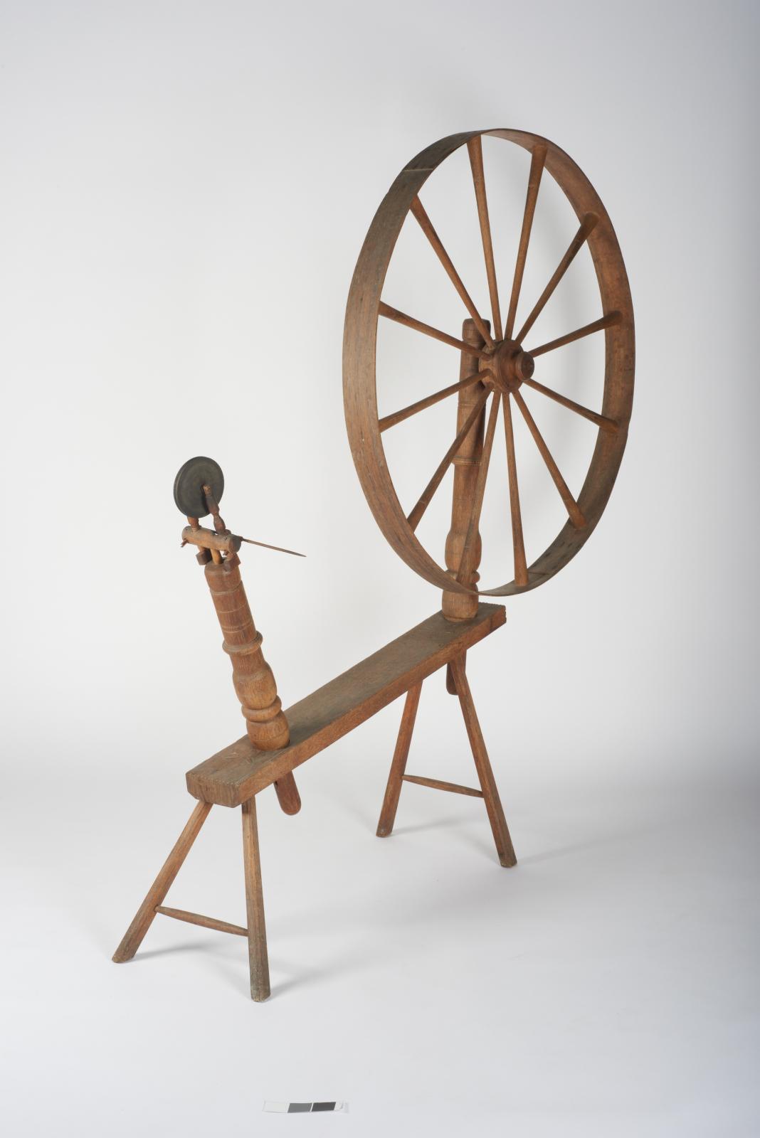 Angled view of spinning wheel.