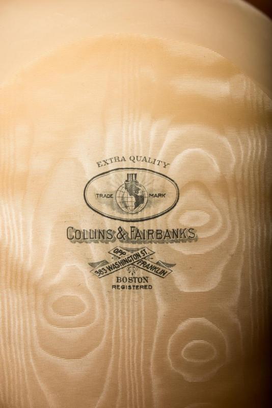 Interior detail of silk-lined beaver skin top hat, with a hat maker's stamp that shows the Collins and Fairbanks Co. trademark.