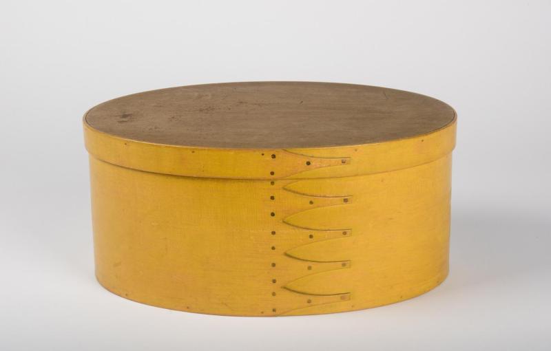 Large, oval, pine and maple box, smooth and plain with six fingers forming a side seam and a chrome yellow finish.