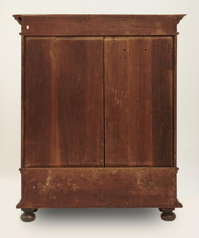 Rear view of large wooden wardrobe.