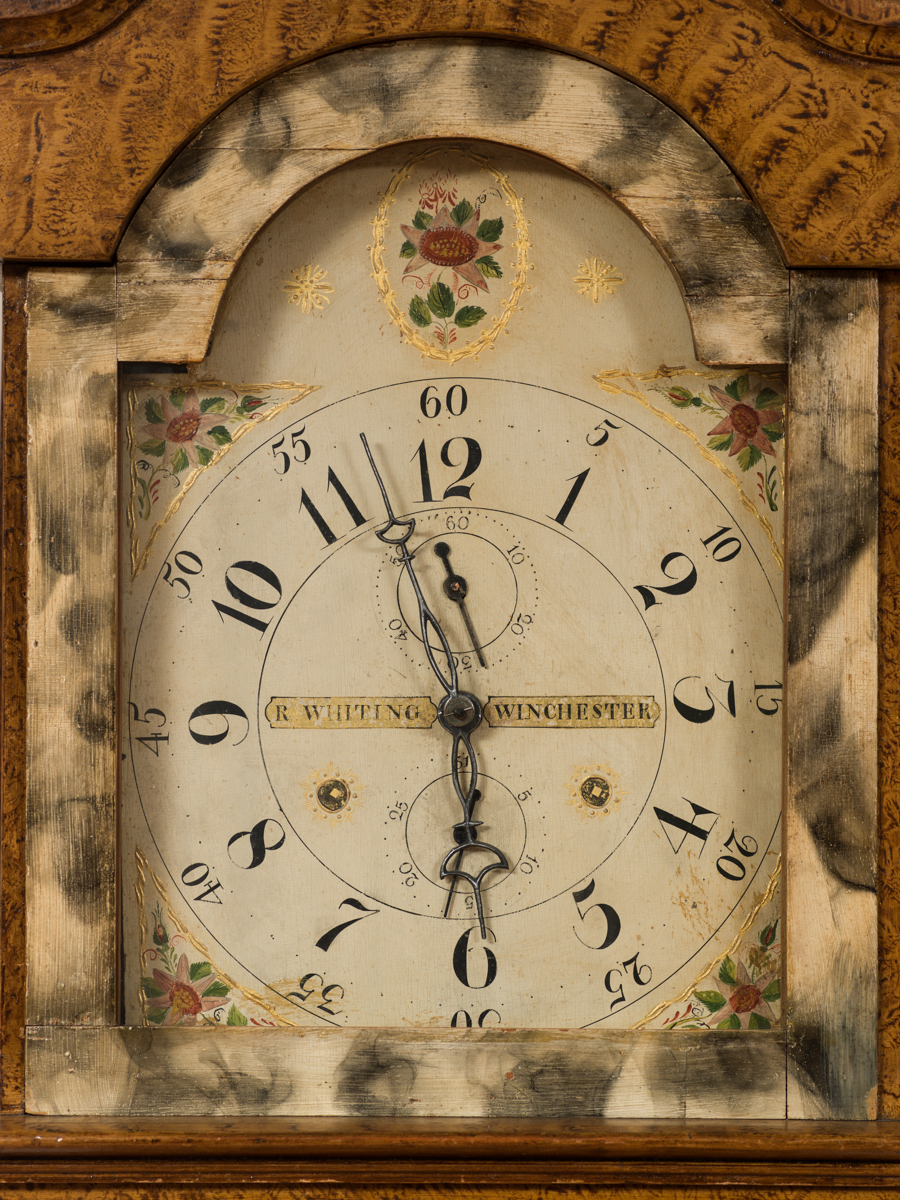 Detail of face of case clock.