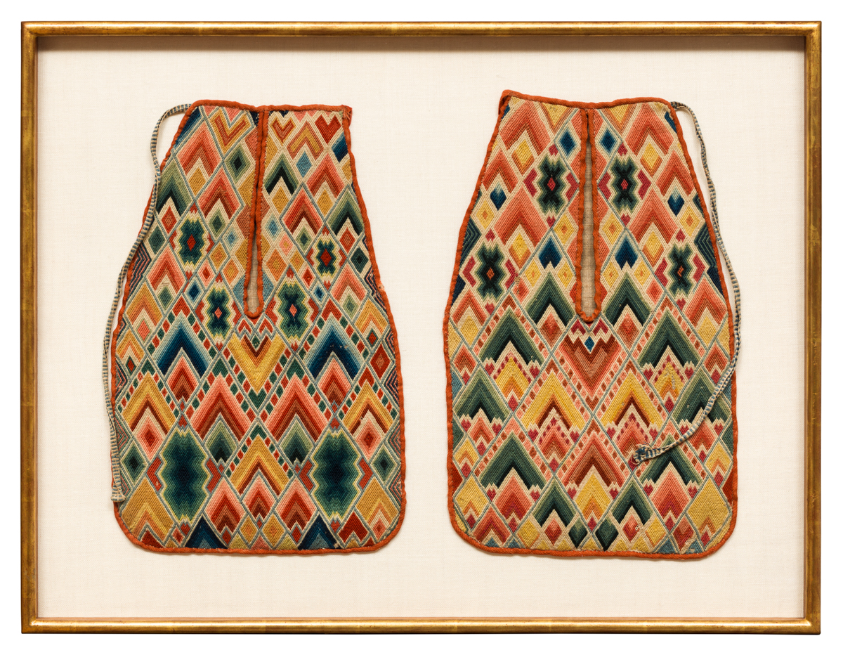 Two embroidered fabric pockets in the shape of small sacks with multicolored flame-like patterns stitched neatly in combinations of red, green, blue and yellow.