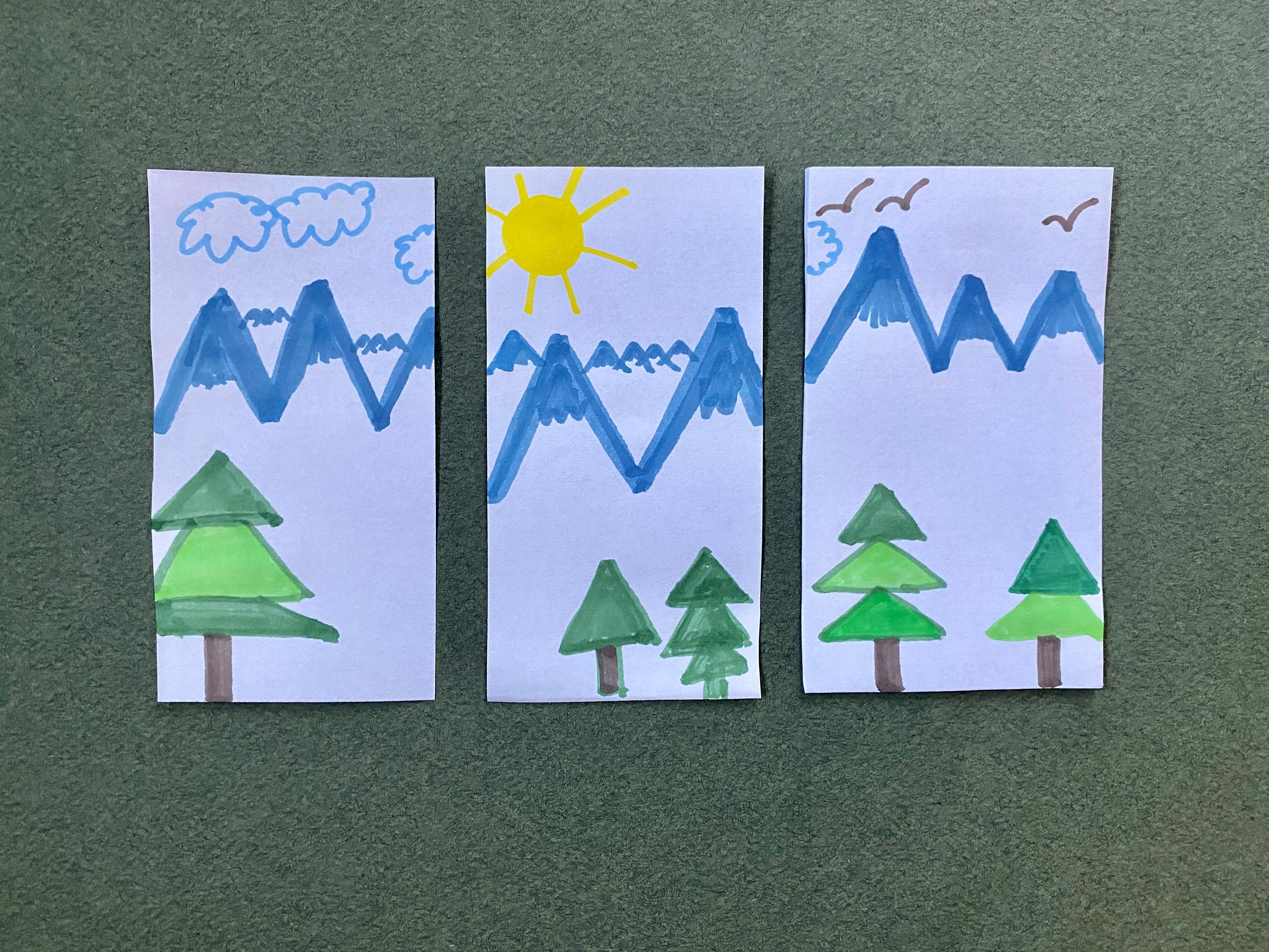 Three rectangles depicting a mountain scene with clouds, birds, a sun, and green trees.