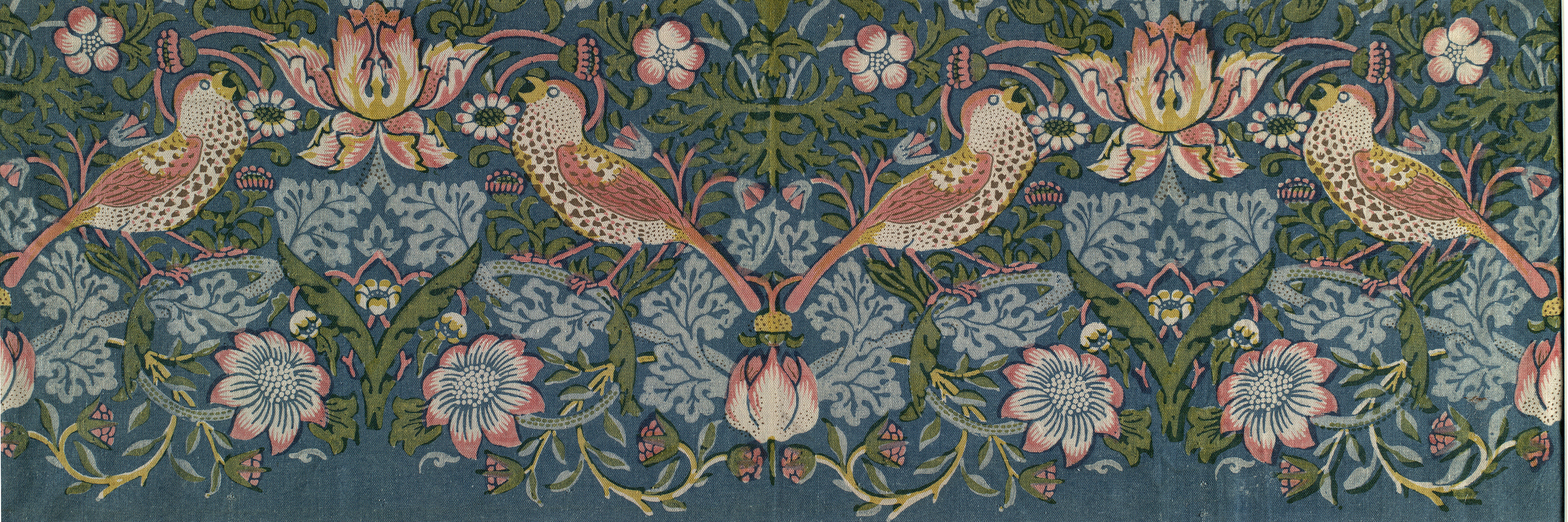 Symmetrical artwork shows stylized plant parts in reds, blues, and greens. Each half of the artwork includes two stylized birds facing blooming flower.
