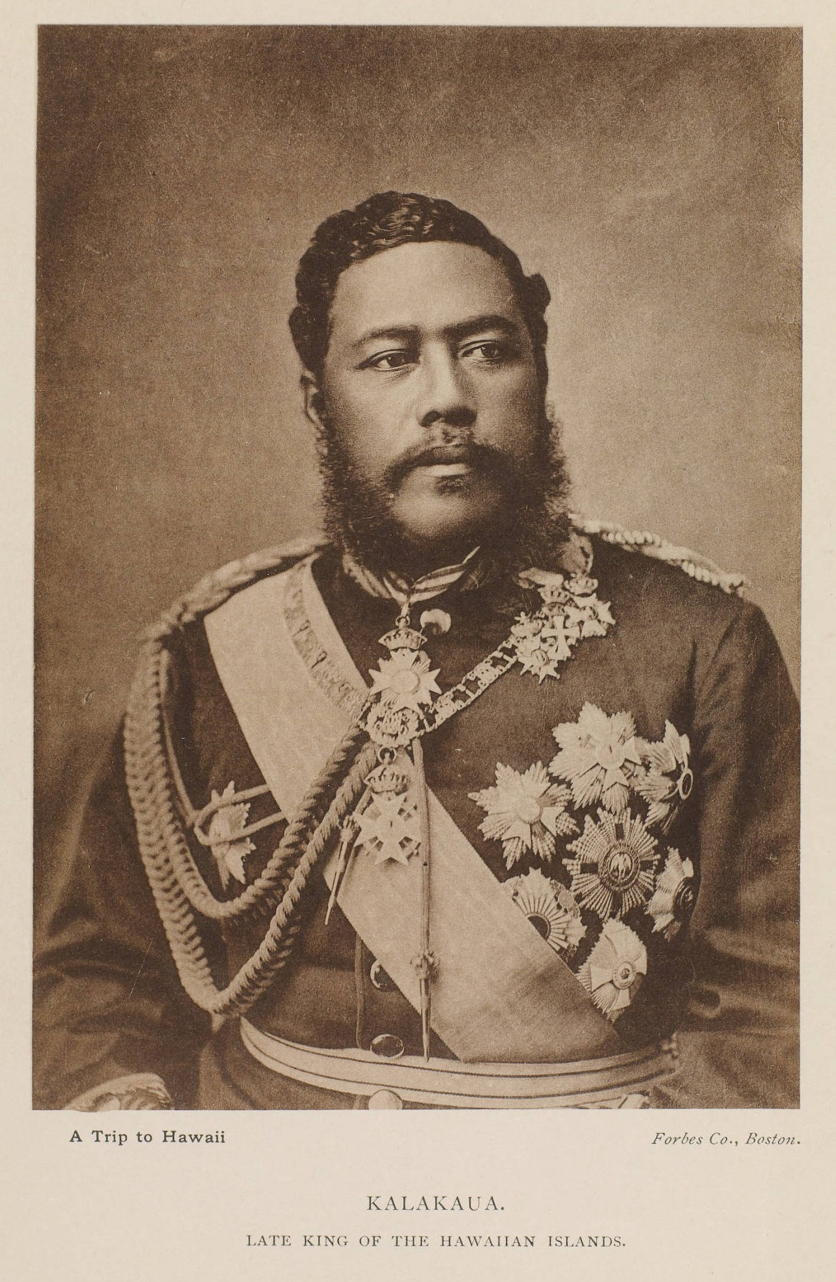 A Hawaiian man in a decorated uniform. Text below the photograph reads: Kalakaua. Late King of the Hawaiian Islands. A Trip to Hawaii. Forbes Co., Benton.