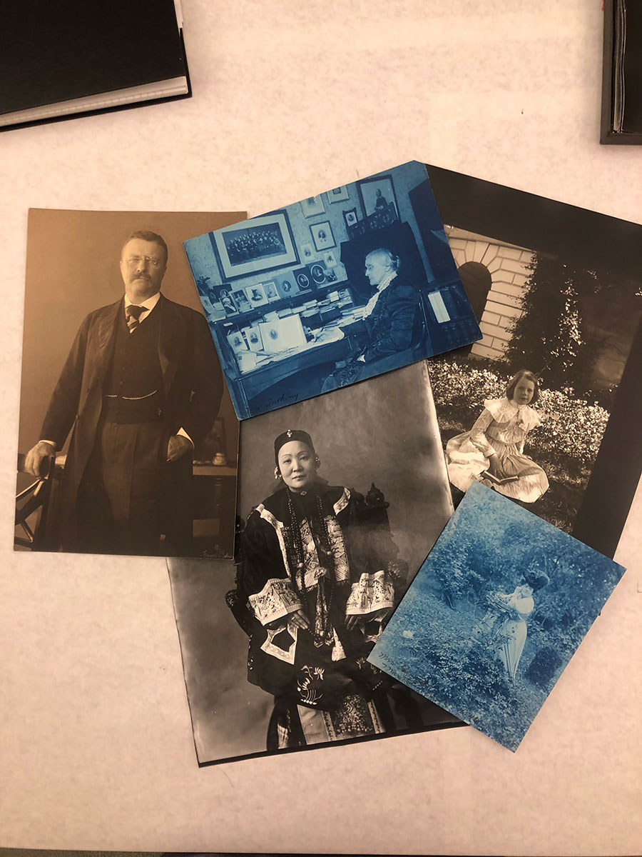 Collage of five photos by Frances B. Johnston on a desk.