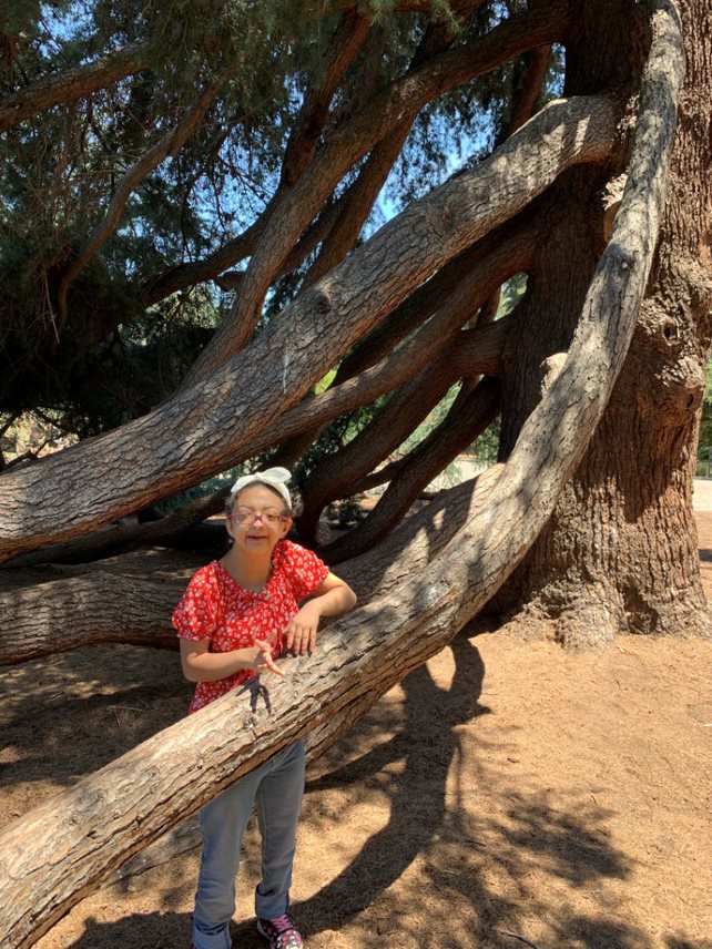 Woman by tree