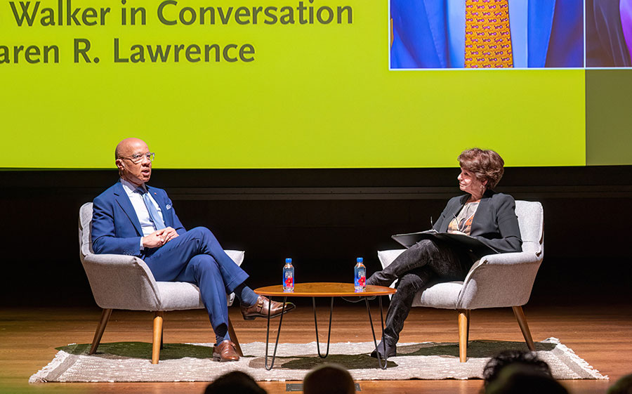 Two people in conversation on a stage.