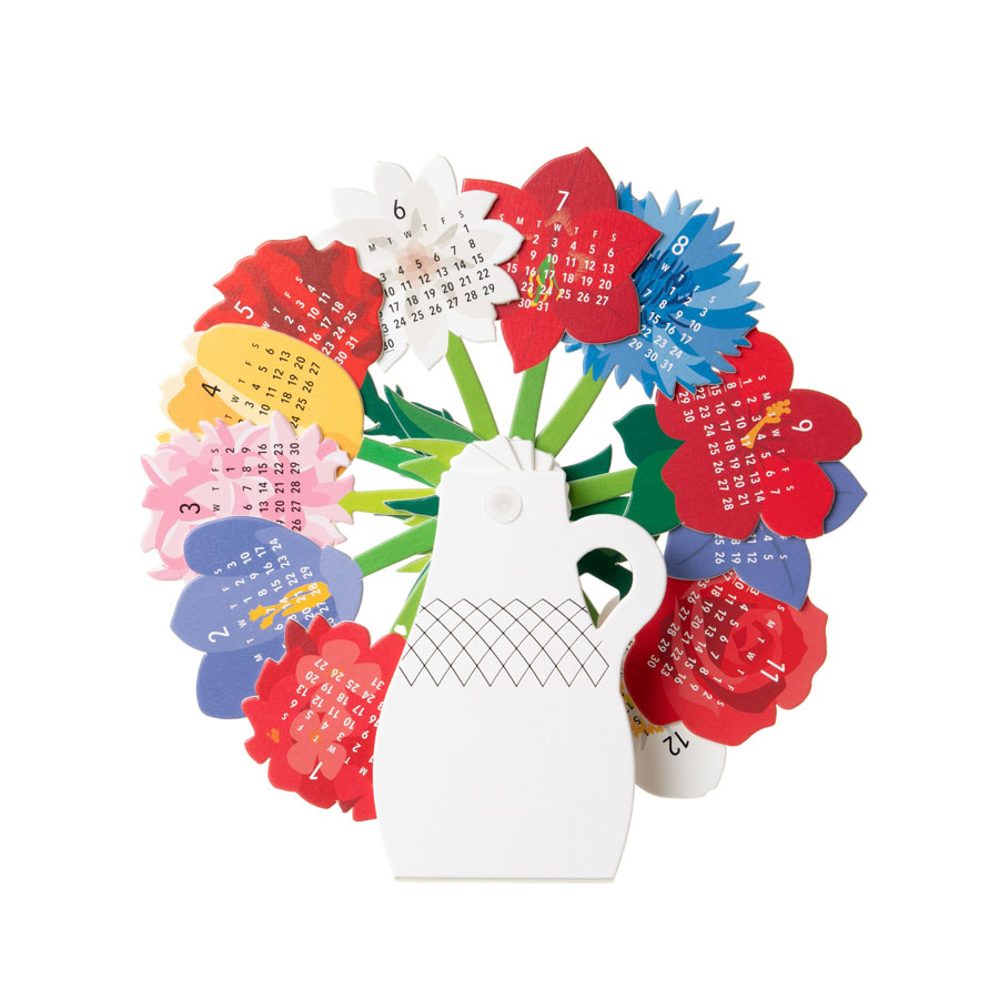 A paper calendar shaped like a vase with flowers.