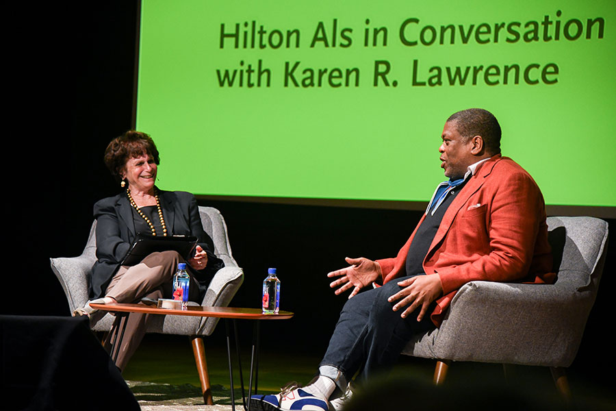 Two people in conversation on a stage.