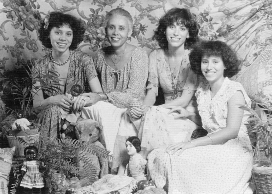 A black-and-white photo of artist Betye Saar with her daughters.