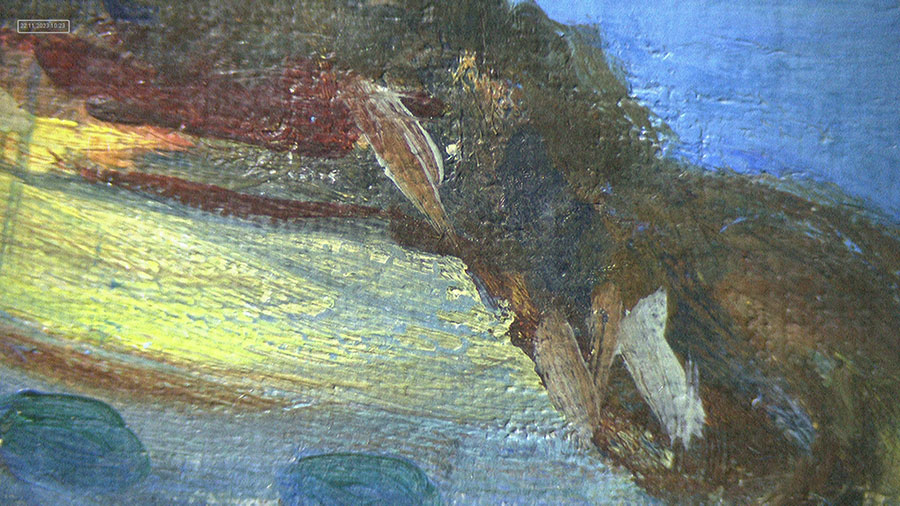 A close-up photo of a painting with strokes of blue, brown, and white.