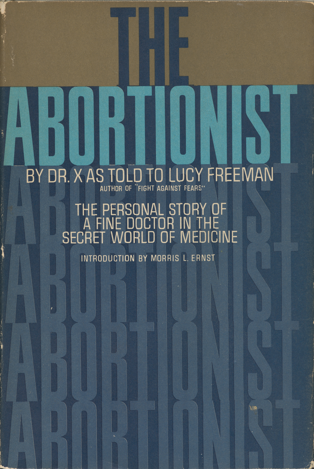 A blue book cover with capitalized text; the title reads “THE ABORTIONIST.”