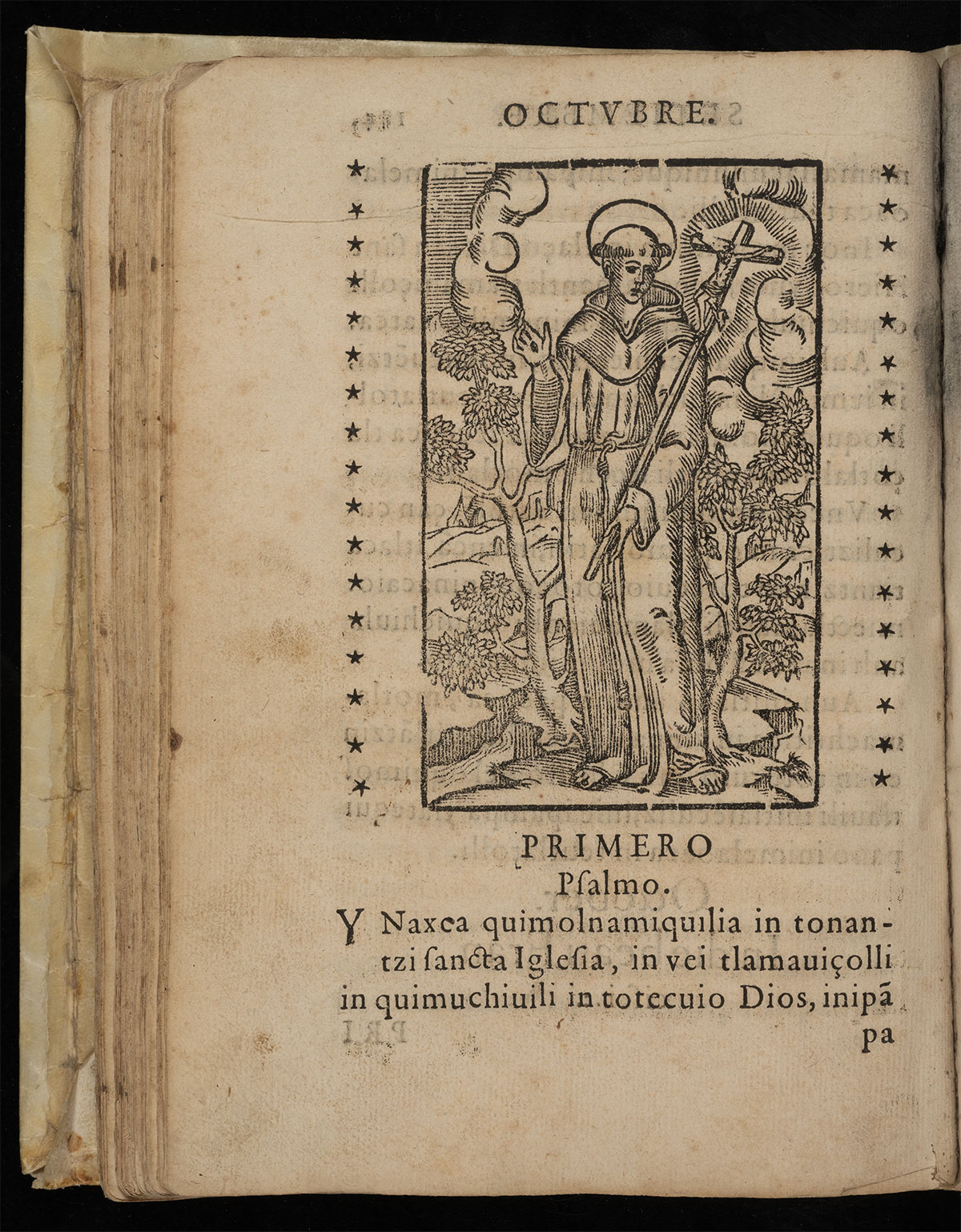 Book page features a woodcut illustration of St. Francies holding a cross surrounded by trees. Spanish and indigenous text below begins with "First Psalm."