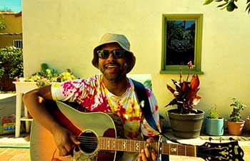 Bhi Bhiman playing guitar