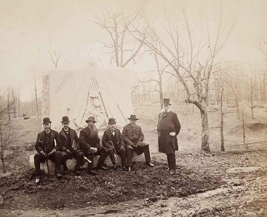 Veterans with John B. Bachelder [standing] at the 29th Ohio Infantry Monument, Gettysburg, ca. 1887. Unidentified photographer.