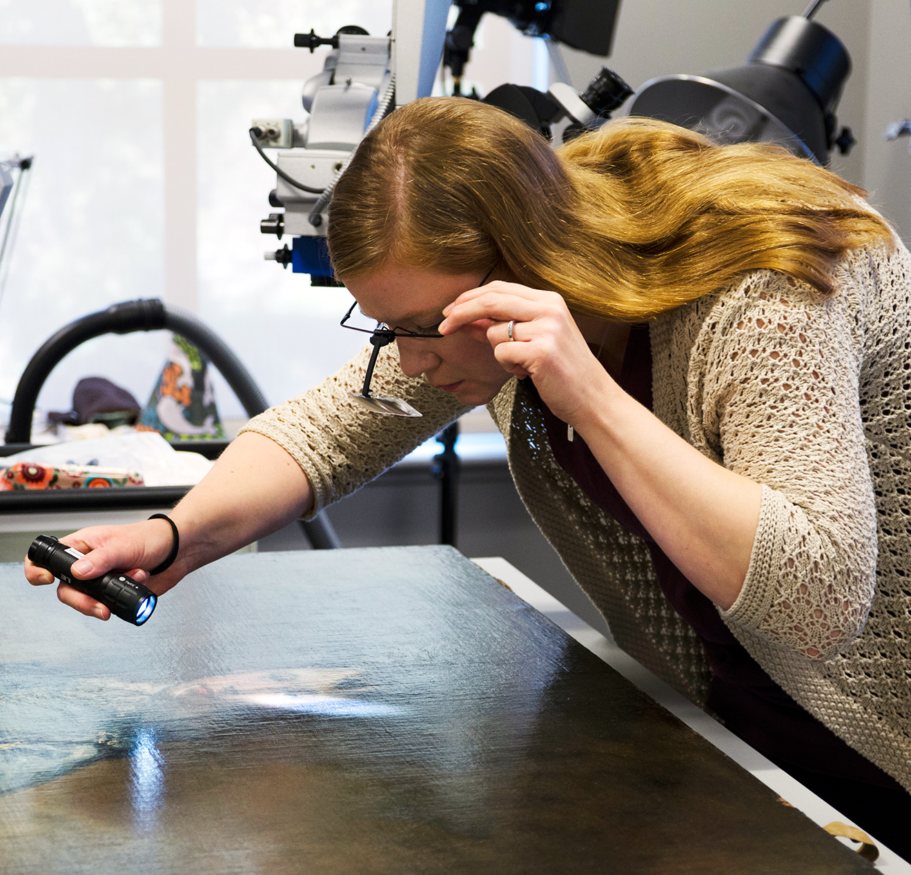 The Huntington’s senior paintings conservator, Christina O’Connell, examines The Blue Boy