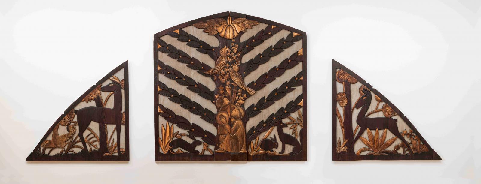 Three panels depict a woodland scene. The panels include humans, animals, and plants. The panels are wood and gold. 