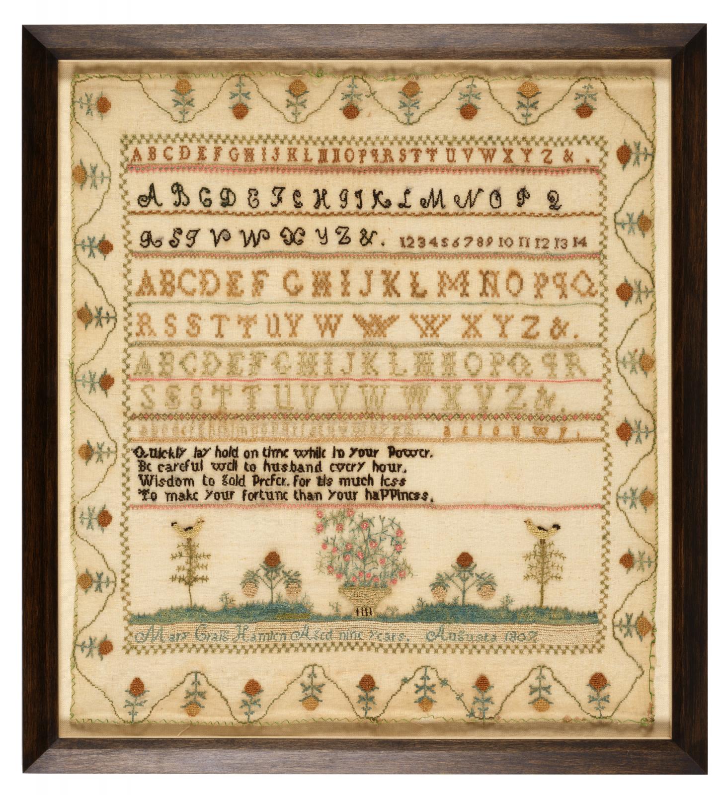 Design embroidered on cloth, with the alphabet repeated in four different fonts and a verse underneath, completed at the bottom with the maker's name, age, and location.  