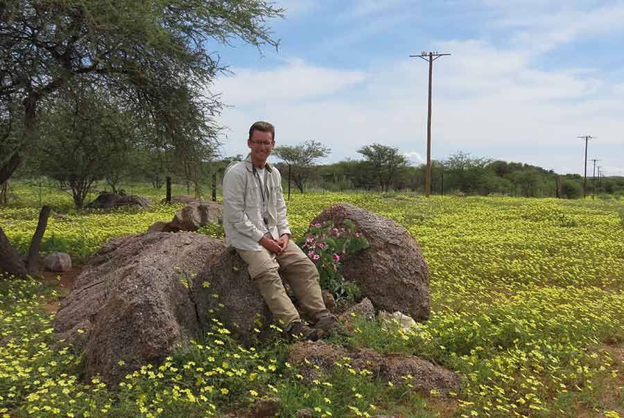 Heavy rain on Cody Howard’s return trip to Namibia rewarded him with a sea of Tribulus flowers near Kamanjab. Moist conditions made it much easier to find Ledebouria bulbs. Photograph by Leevi Nanyeni.