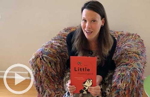 Staff member Kate with The Little Hummingbird book