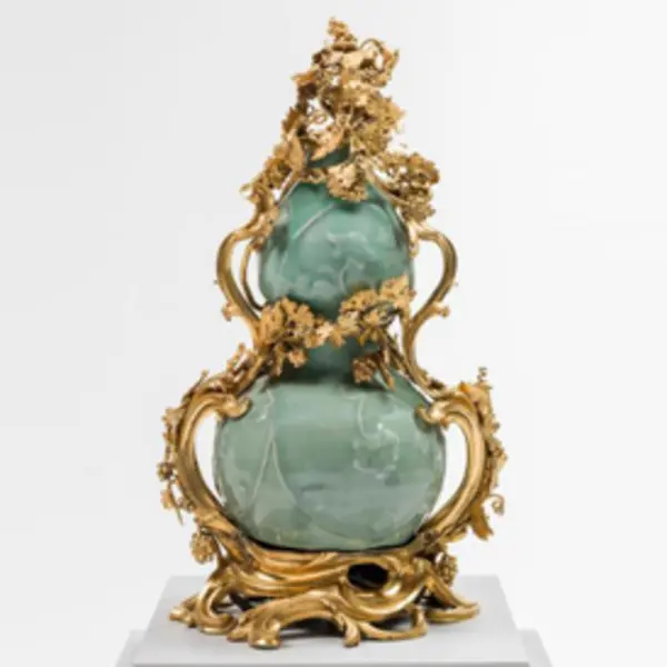 ornate gold vase with jade inset