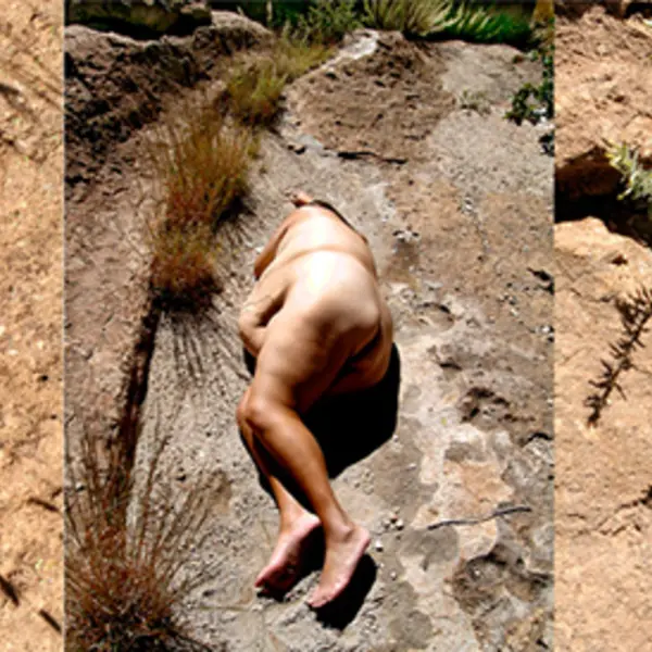 naked woman on desert floor