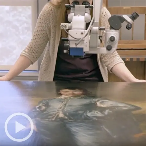 Senior paintings conservator Christina O'Connell goes "eye to eye" with The Huntington's most famous painting with the help of a Hi-R NEO 900 Haag-Streit surgical microscope.
