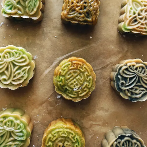 An overhead view of colorful pastries with ornate details.