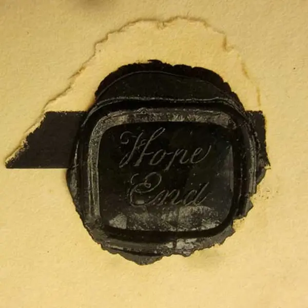 Black wax seal on letter