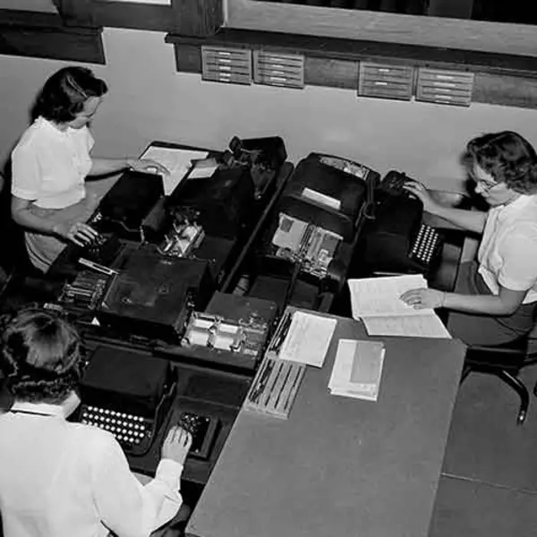 Ladies typing on typewriters 