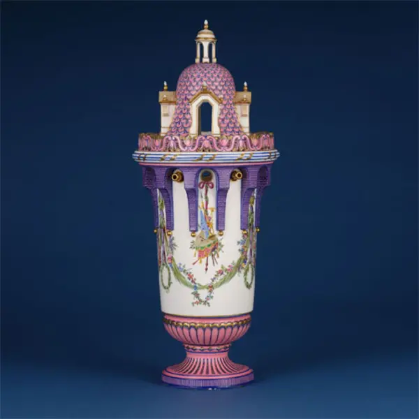 decorative pink and white ceramic vase resembling an ornate castle