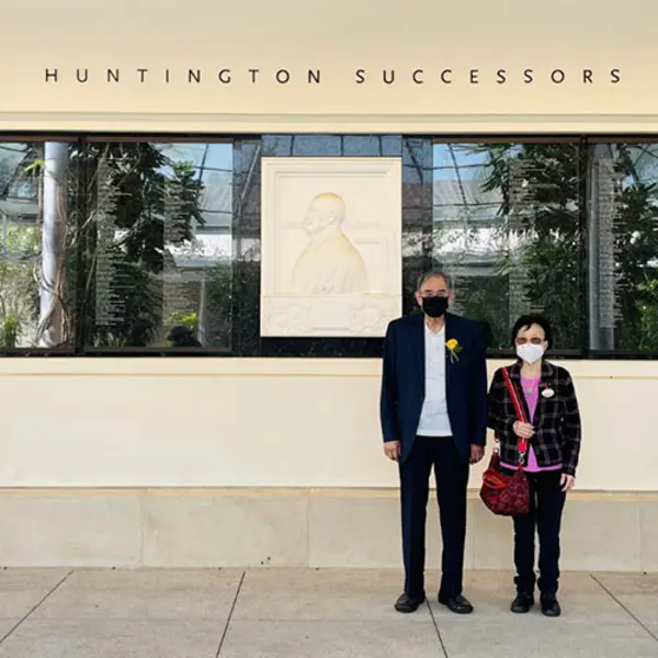 Mr. and Mrs. Chen in front of the Hunting Successors Wall