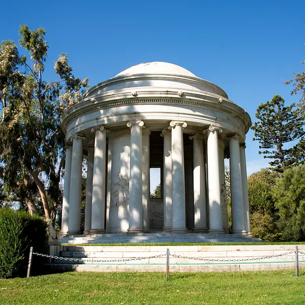 The Huntington Mausoleum stands surrounded by trees and gardens