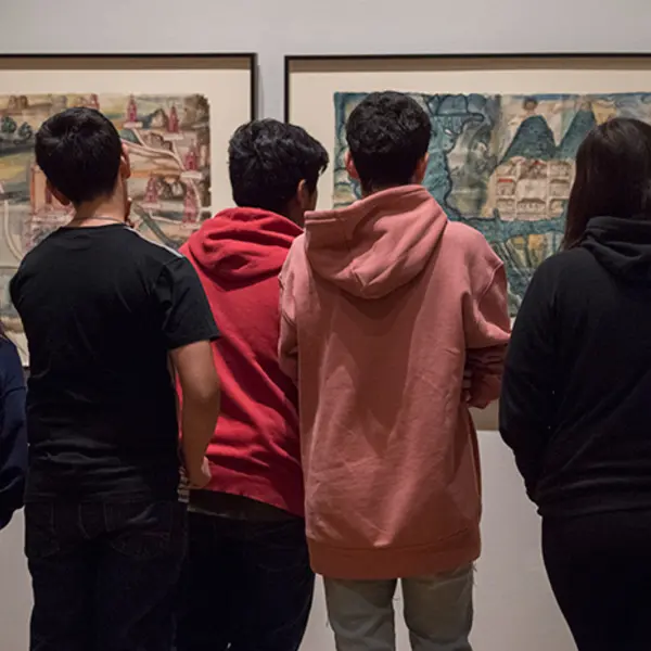 Teenagers looking at exhibition