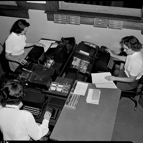 Edison photographer Doug White’s overhead shot of three computer key punch operators creating data entry cards