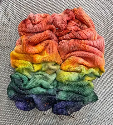 Two colorful dyed socks scrunched together.