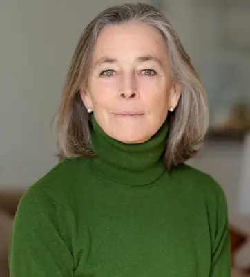 Headshot of Katherine Bucknell wearing a forest green turtleneck.