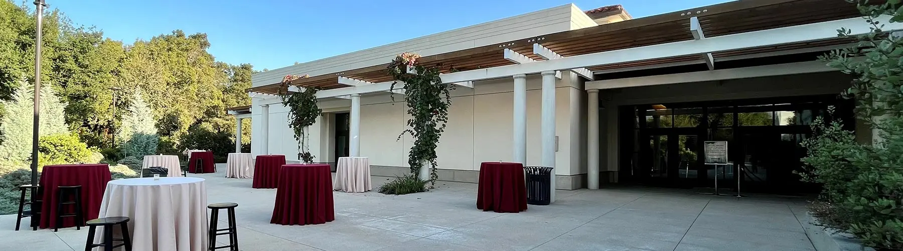 Cocktail tables set up in the Nancy Barry Munger Terrace.