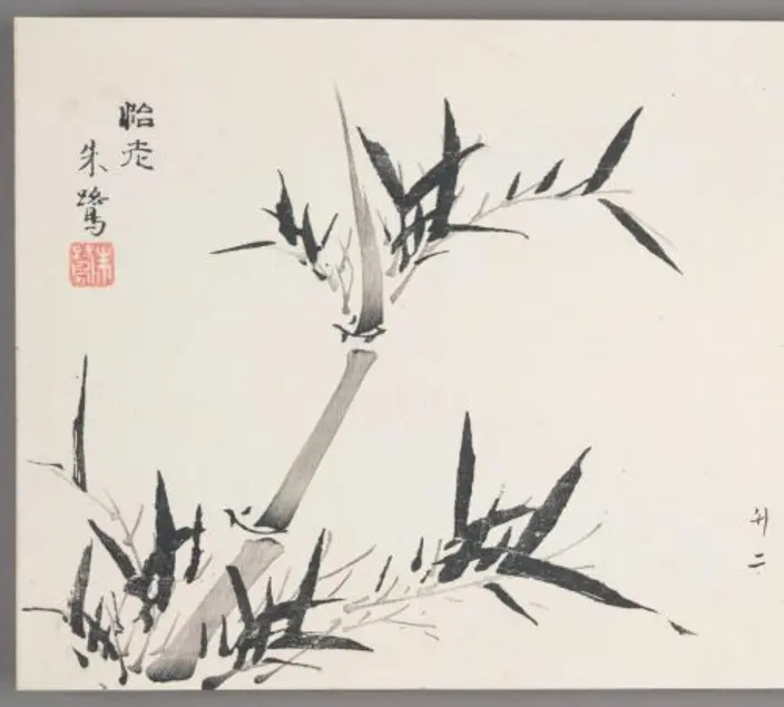 Woodblock print featuring a grey bamboo stalk with black bamboo leaves. 