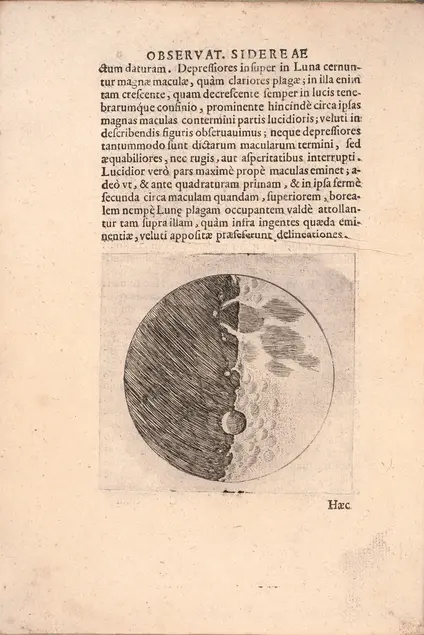 An illustration of the moon with a jagged line down the center separating the black left half from the light right half. shaded areas are on the surface. Printed Latin text is above the illustration.