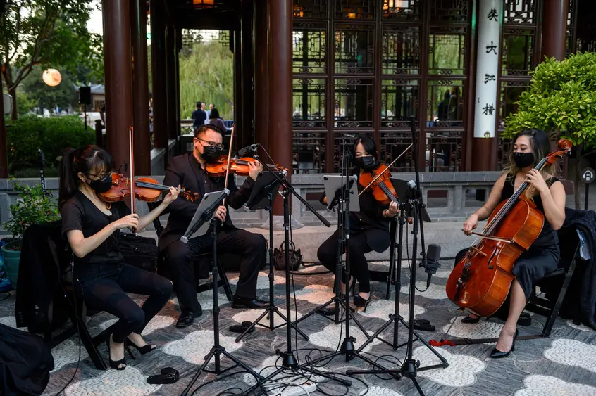 string musicians outside Chinese pavilion
