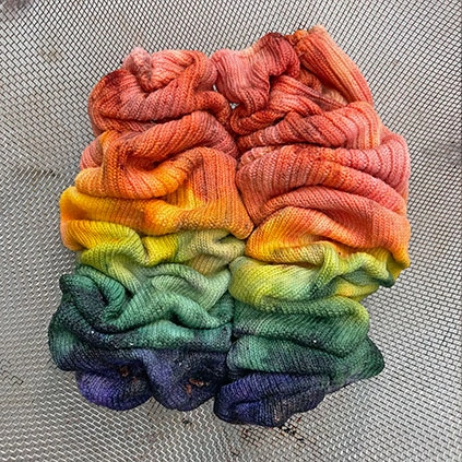 Two colorful dyed socks scrunched together.