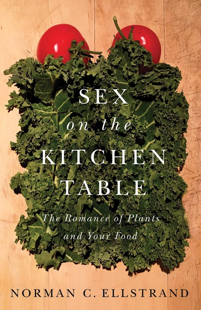 A book cover with a bed of kale and tomatoes as pillows; the text reads “Sex on the Kitchen Table: The Romance of Plants and Your Food.”