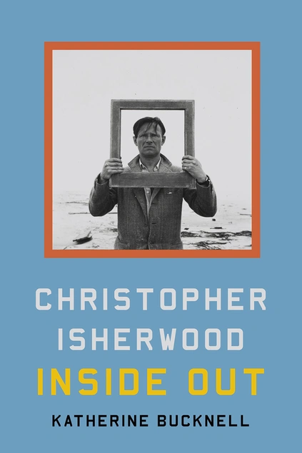 Christopher Isherwood holds a picture frame around his head while standing in water.