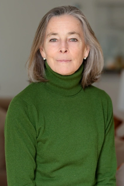 Headshot of Katherine Bucknell wearing a forest green turtleneck.