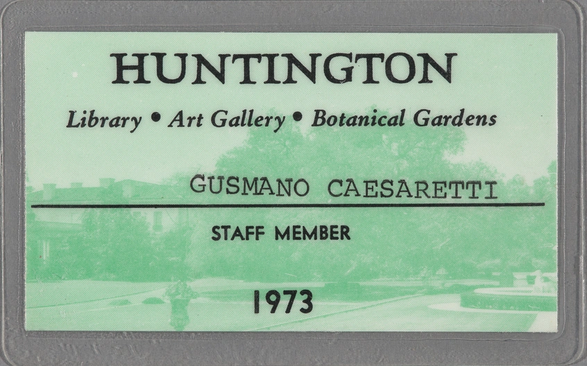 A light-green laminated card that reads "HUNTINGTON / Library, Art Gallery, Botanical Gardens / GUSMANO CAESARETTI / STAFF MEMBER / 1973." 