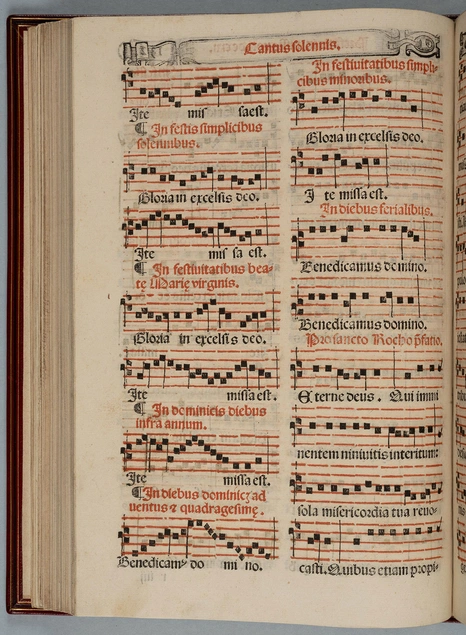 A book opened to a page with musical notation.